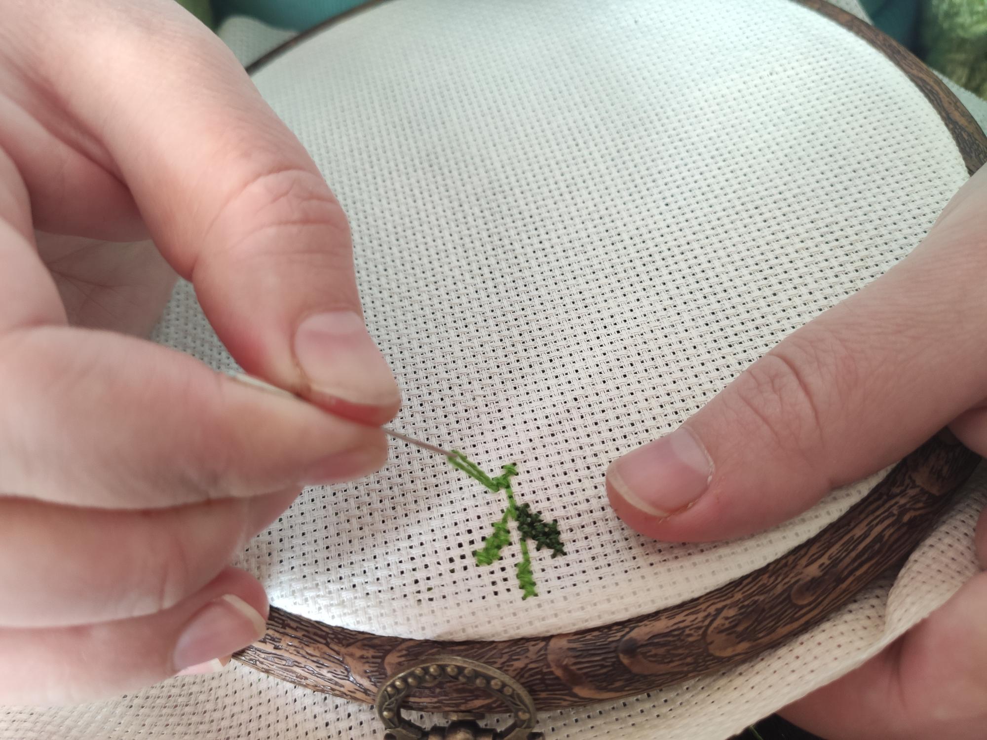 Close-up vintage hand embroidery on linen
